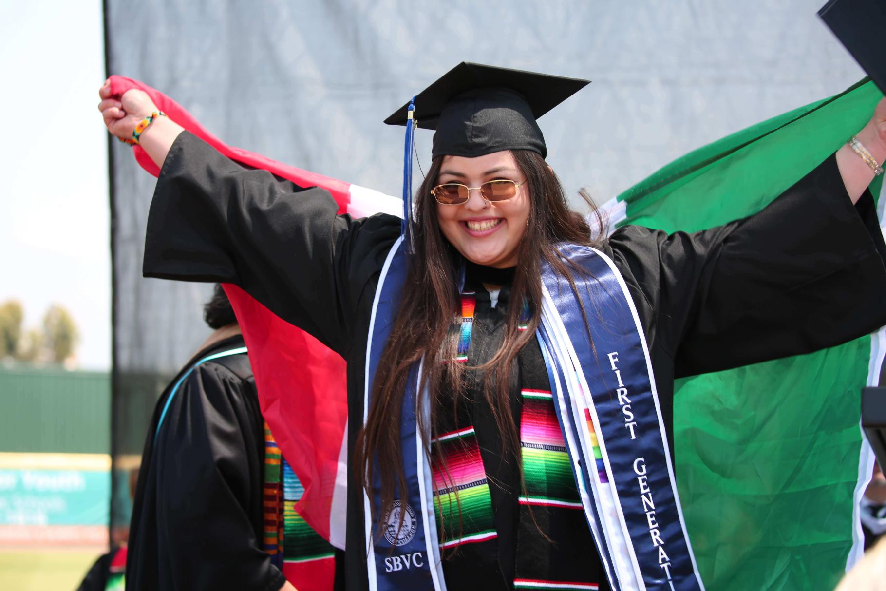 A graduate with the flag of Mexico