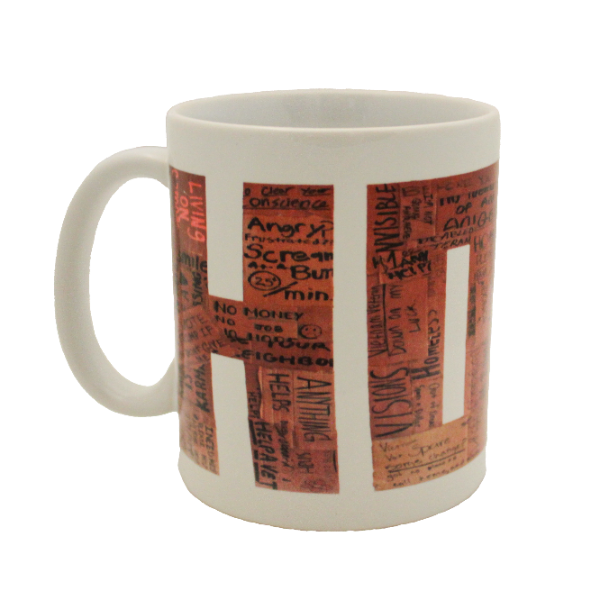 Gresham Gallery white mug with the the word "HOME" made out of homeless people's cardboard signs