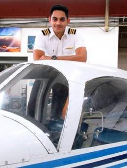 A photo of Rajveer Singh posing with a plane