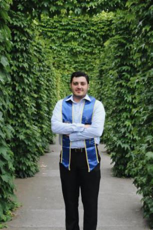 A photo of Zachery Robinson graduating from Berkeley 