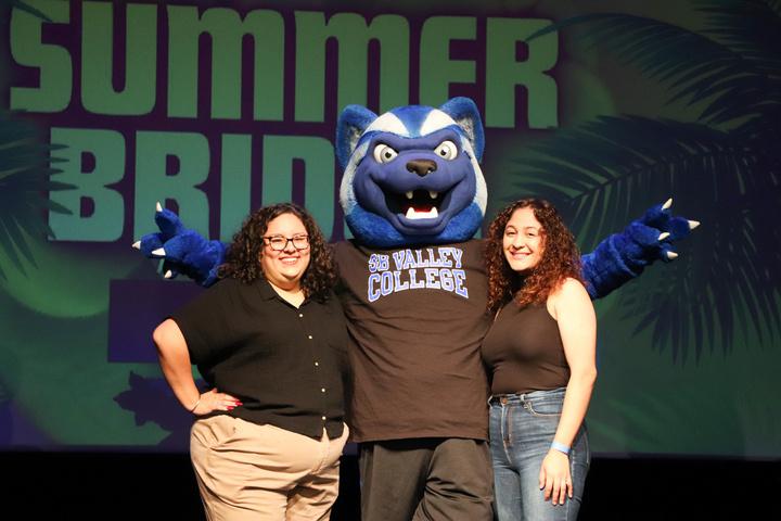 Blue with faculty from the Summer Bridge program