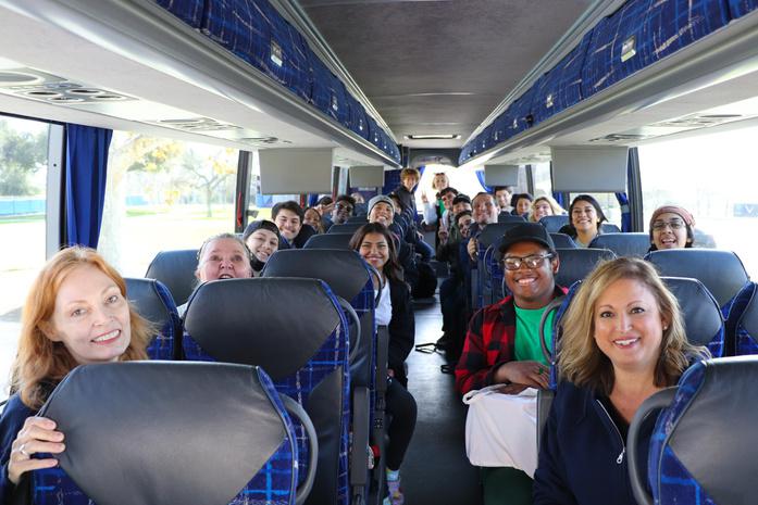 Group photo of the cast of Little Shop of Horrors on the bus to Las Vegas