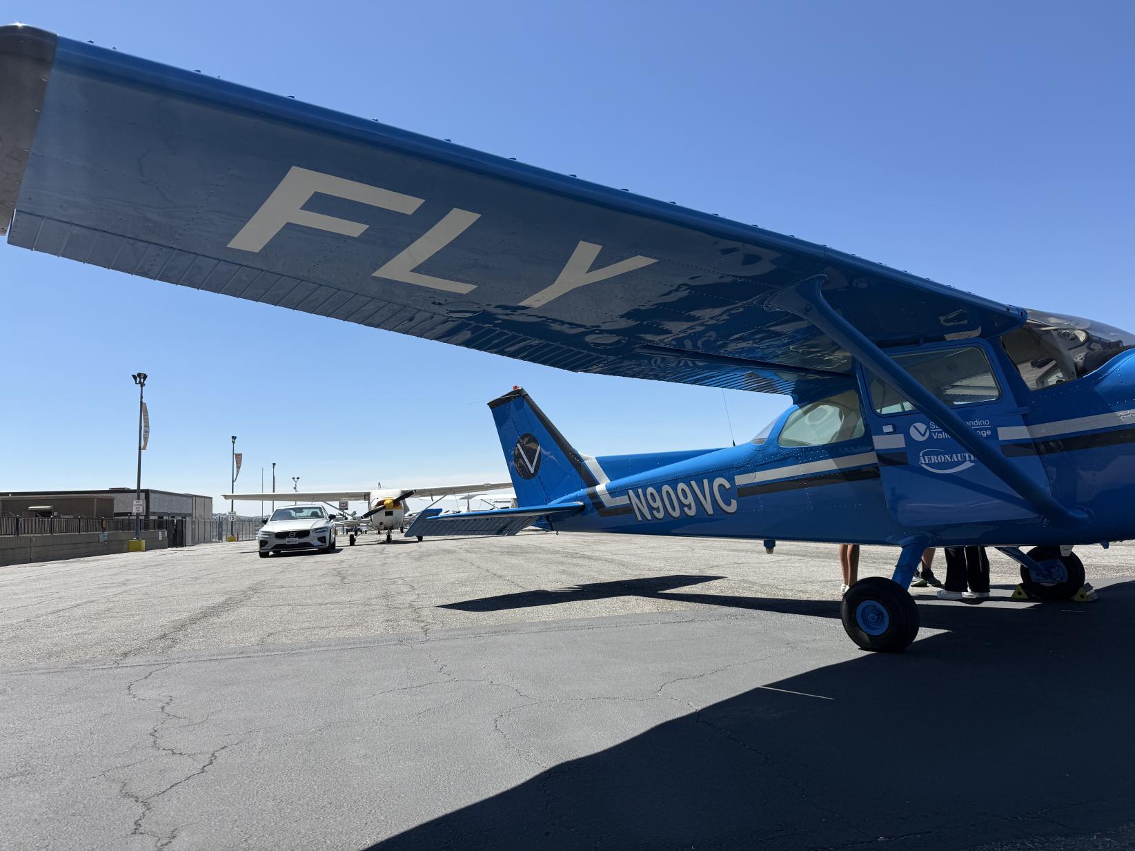 A plane with the words FLY under the wing painted Valley Blue