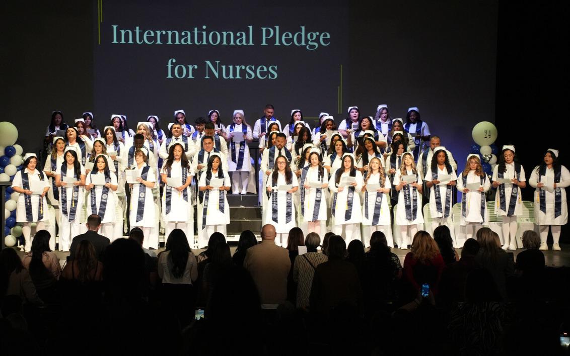 Largest nursing class standing on stage
