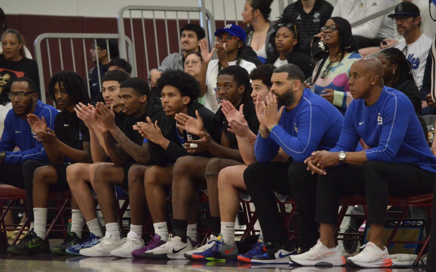 Coach Quincy Brewer watching from the sidelines