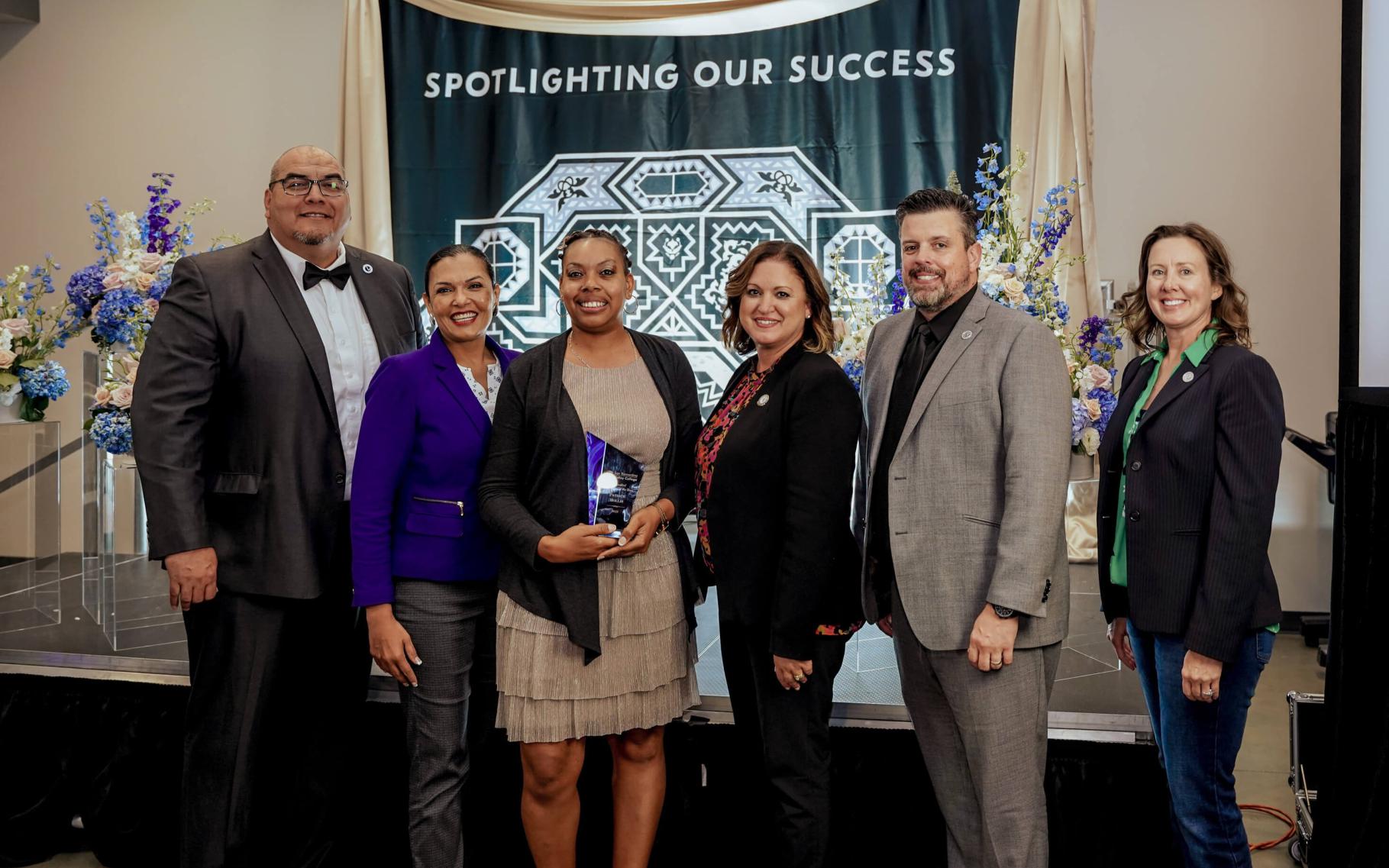 Group photo with admin and spotlighting winner