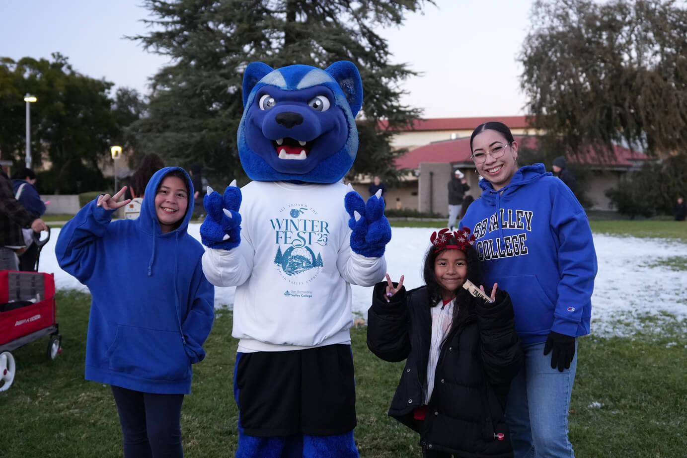 Blue posing with some kids