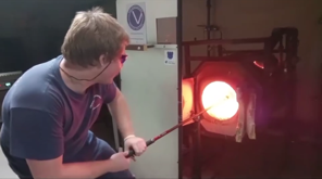 Man makes molten glass