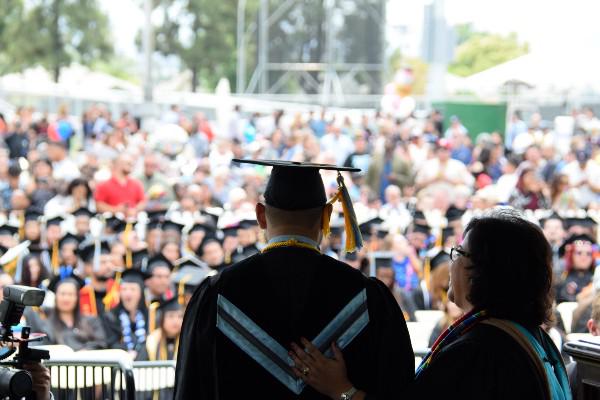 President Diana Z. Rodriguez congratulates a graduate during Commencement 2017.