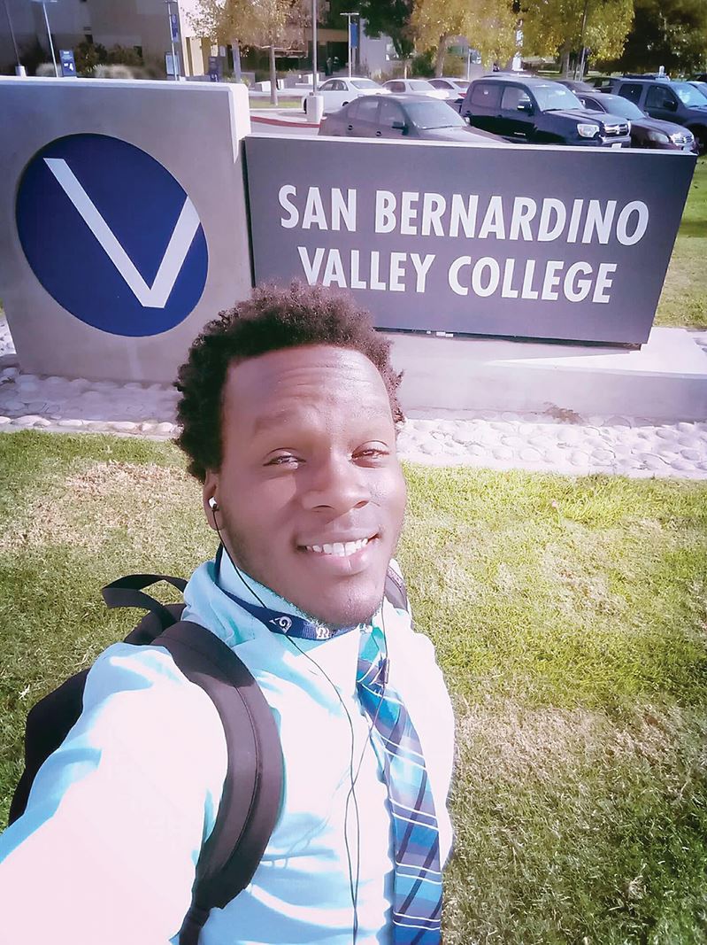 Devonte Kilgore poses in front of the V-ball