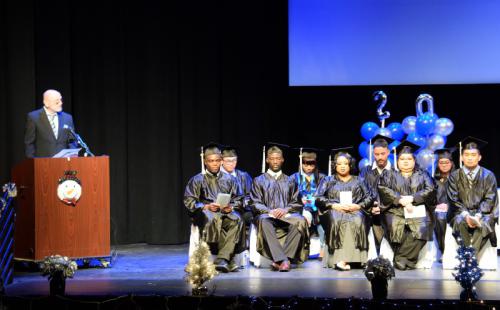 Program Director Dennis Jackson congratulates psychiatric technology graduates during their graduation in December 2016.