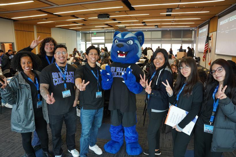 Students with Blue flashing the "Valley Up" symbol
