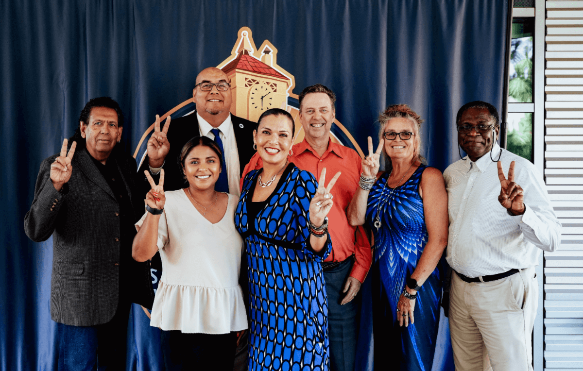 SBVC administrators flashing the "Valley Up" symbol