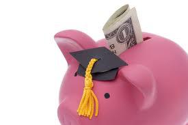 Piggy bank with graduation cap and $1 bill