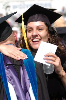graduate giving hug