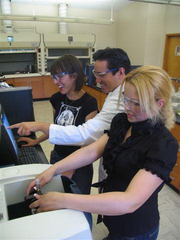 students working with chemistry professor michael torrez